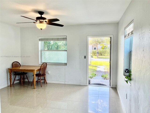 3135 SW 64th Ave, Miami, FL 33155 - foyer entrance with healthy amount of natural light, a ceiling fan, and baseboards