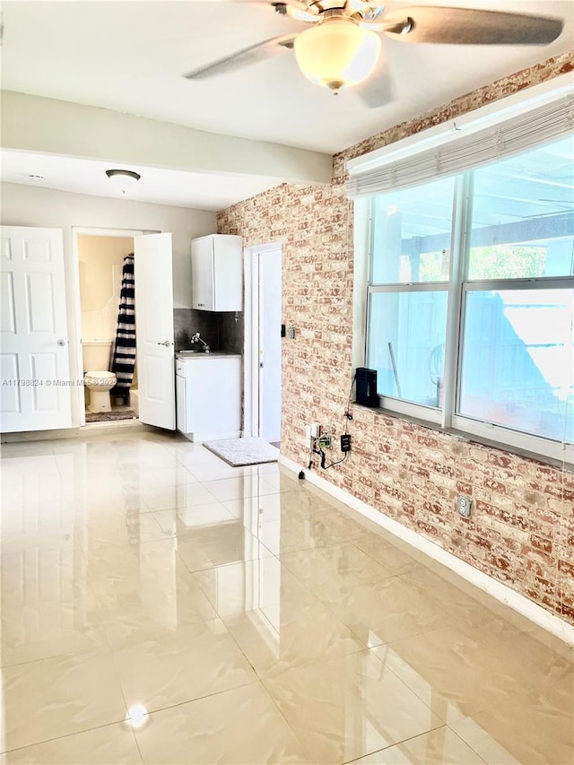 3135 SW 64th Ave, Miami, FL 33155 - empty room featuring baseboards, ceiling fan, and a sink