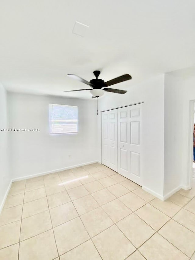 3135 SW 64th Ave, Miami, FL 33155 - unfurnished bedroom with light tile patterned floors, a closet, and ceiling fan