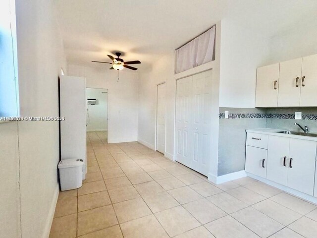 3135 SW 64th Ave, Miami, FL 33155 - kitchen with a sink, ceiling fan, light tile patterned flooring, and light countertops