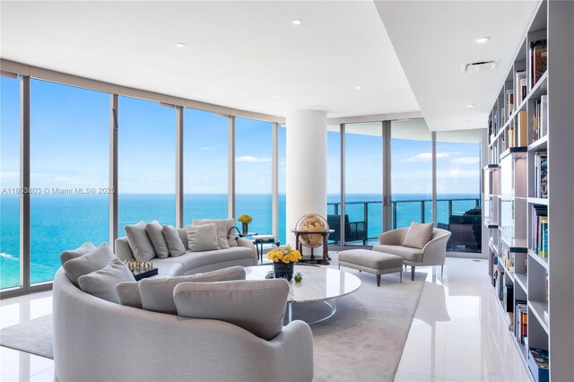 15701 Collins Ave Unit 3201, Sunny Isles Beach, FL 33160 - tiled living area with floor to ceiling windows and a water view
