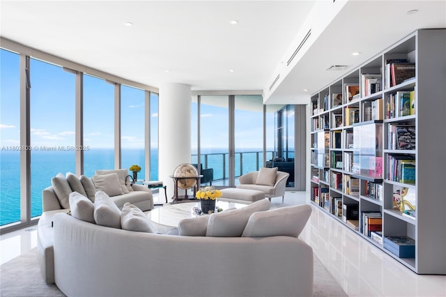 15701 Collins Ave Unit 3201, Sunny Isles Beach, FL 33160 - living area featuring a water view, expansive windows, and built in shelves