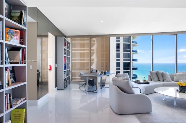 15701 Collins Ave Unit 3201, Sunny Isles Beach, FL 33160 - living area featuring tile patterned floors, healthy amount of natural light, and a water view
