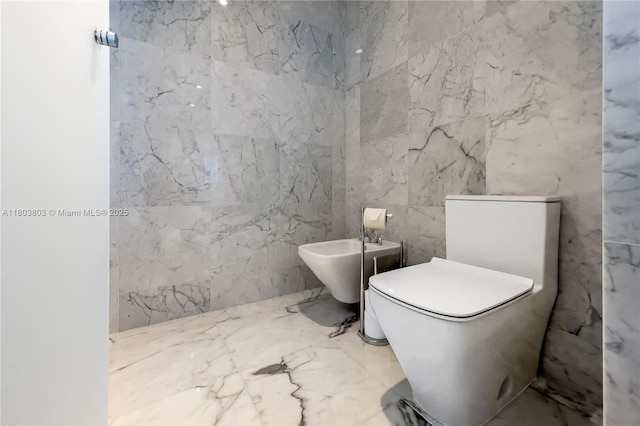 15701 Collins Ave Unit 3201, Sunny Isles Beach, FL 33160 - bathroom with toilet, tile walls, a bidet, and marble tiled flooring