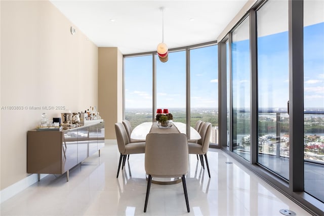 15701 Collins Ave Unit 3201, Sunny Isles Beach, FL 33160 - dining area featuring expansive windows, light tile patterned flooring, and bar area