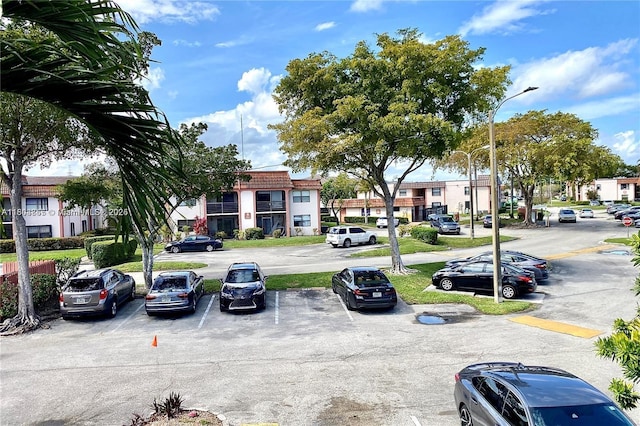 880 NE 207th Ter Unit 202-10, Miami, FL 33179 - view of asphalt street featuring street lighting