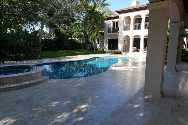 7740 SW 79th Ct, Miami, FL 33143 - view of pool featuring a patio and a pool with connected hot tub