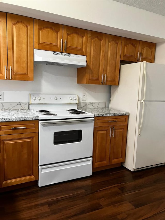 203 Lake Pointe Dr Unit 108, Oakland Park, FL 33309 - kitchen featuring white appliances, under cabinet range hood, brown cabinets, dark wood-style floors, and light stone countertops