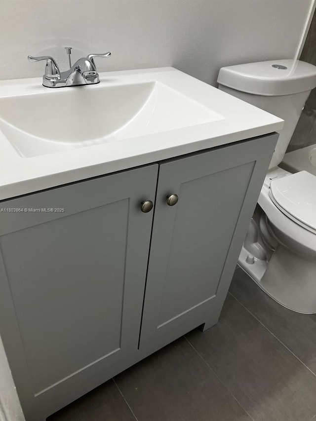 203 Lake Pointe Dr Unit 108, Oakland Park, FL 33309 - bathroom with vanity, toilet, and tile patterned flooring