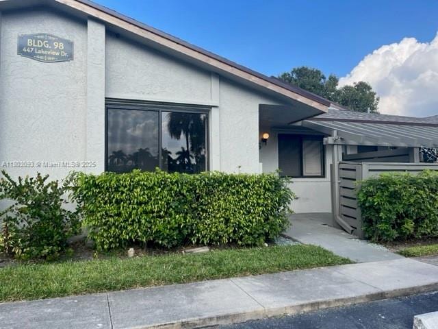 447 Lakeview Dr Unit 5, Weston, FL 33326 - view of exterior entry with stucco siding