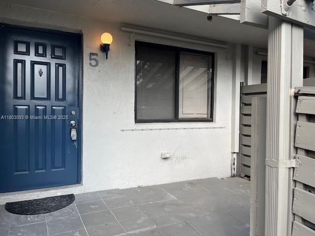447 Lakeview Dr Unit 5, Weston, FL 33326 - view of exterior entry featuring stucco siding