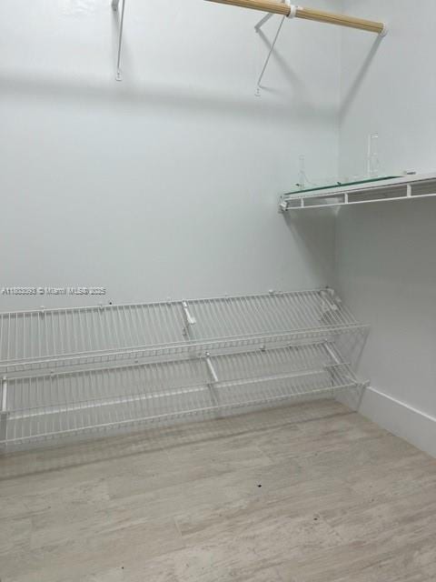 447 Lakeview Dr Unit 5, Weston, FL 33326 - walk in closet with wood finished floors