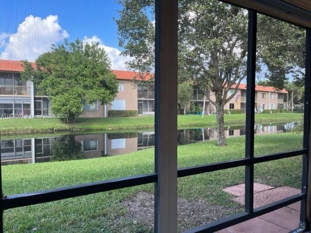 447 Lakeview Dr Unit 5, Weston, FL 33326 - doorway to outside with a water view