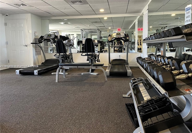 exercise room featuring a drop ceiling
