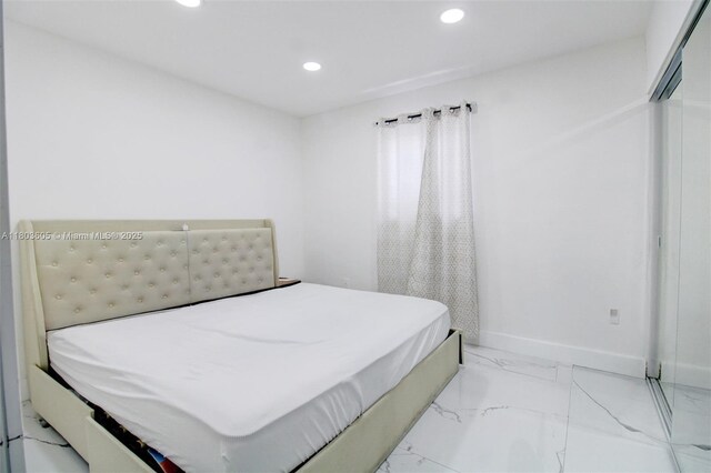 7917 Kismet St, Miramar, FL 33023 - bedroom featuring recessed lighting, light marble finish floors, and baseboards