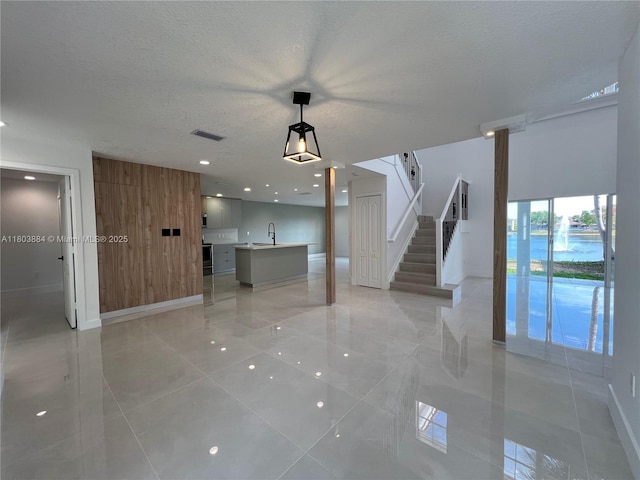 16247 SW 46th Ter, Miami, FL 33185 - empty room featuring stairway, light tile patterned flooring, a textured ceiling, baseboards, and recessed lighting