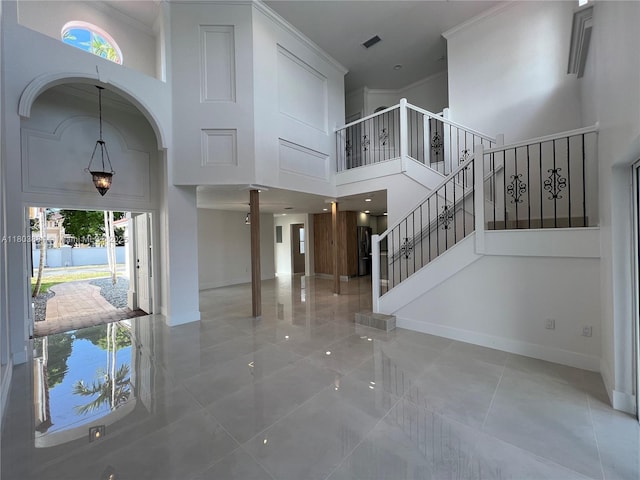 16247 SW 46th Ter, Miami, FL 33185 - foyer entrance with a towering ceiling, plenty of natural light, decorative columns, baseboards, and tile patterned flooring
