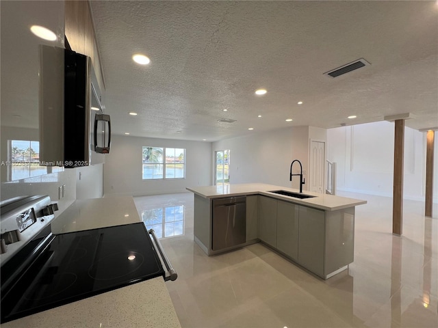 16247 SW 46th Ter, Miami, FL 33185 - kitchen with a sink, appliances with stainless steel finishes, open floor plan, a textured ceiling, and recessed lighting