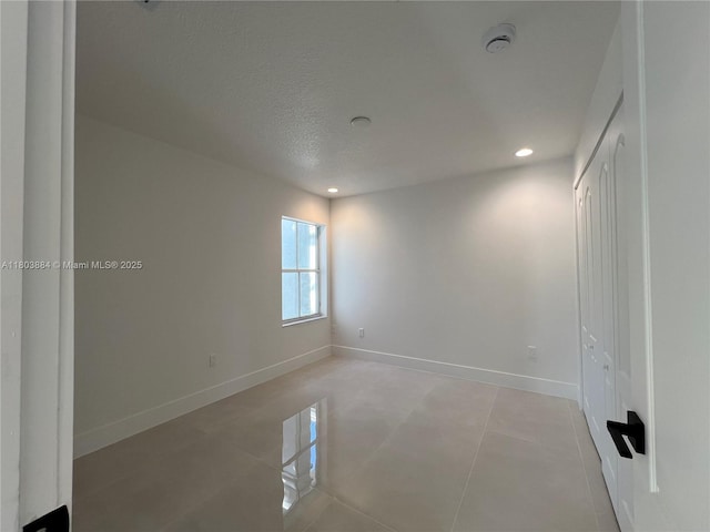 16247 SW 46th Ter, Miami, FL 33185 - spare room featuring baseboards, a smoke detector, light tile patterned floors, recessed lighting, and a textured ceiling