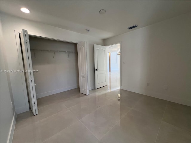 16247 SW 46th Ter, Miami, FL 33185 - unfurnished bedroom with a closet, baseboards, light tile patterned flooring, and recessed lighting