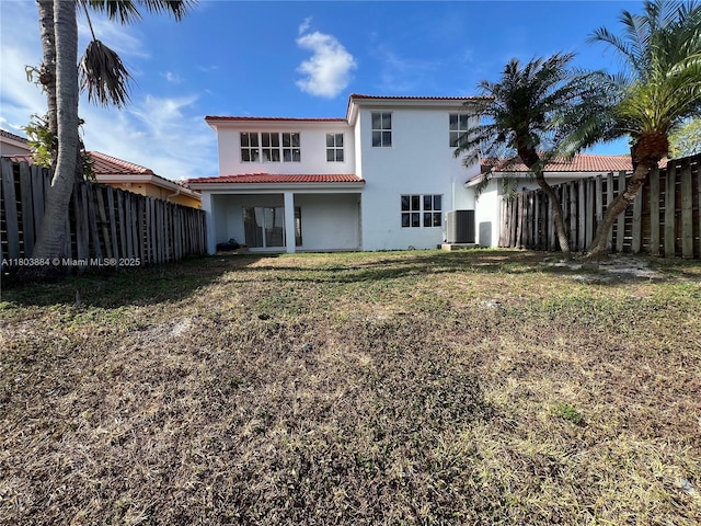 16247 SW 46th Ter, Miami, FL 33185 - back of house featuring a tile roof, fence, stucco siding, and central AC unit