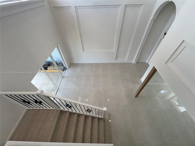 16247 SW 46th Ter, Miami, FL 33185 - staircase with plenty of natural light, arched walkways, and baseboards