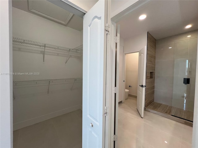16247 SW 46th Ter, Miami, FL 33185 - bathroom featuring a stall shower, toilet, tile patterned flooring, recessed lighting, and a walk in closet
