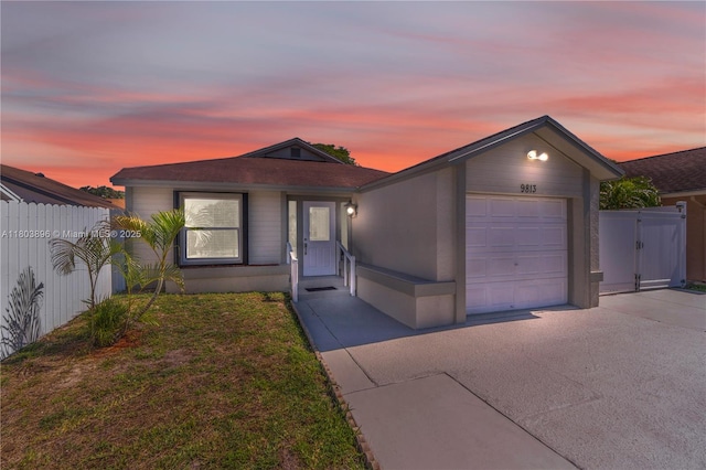 9813 SW 57th St, Cooper City, FL 33328 - view of front of property with a garage, driveway, and a gate