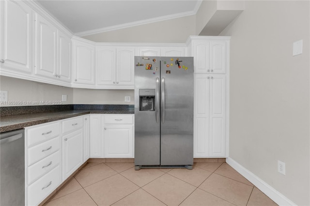 9813 SW 57th St, Cooper City, FL 33328 - kitchen featuring stainless steel appliances, lofted ceiling, white cabinets, dark countertops, and light tile patterned floors