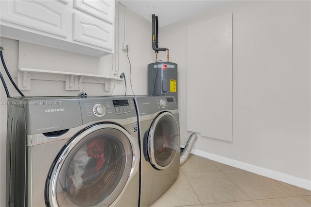 9813 SW 57th St, Cooper City, FL 33328 - clothes washing area with separate washer and dryer, electric water heater, cabinet space, light tile patterned flooring, and baseboards