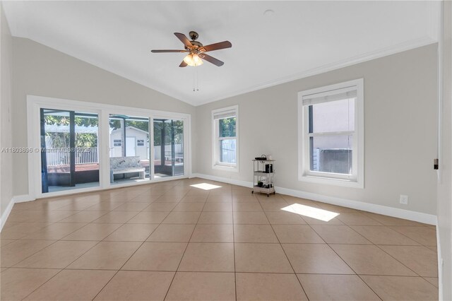 9813 SW 57th St, Cooper City, FL 33328 - empty room with baseboards, vaulted ceiling, light tile patterned floors, a ceiling fan, and crown molding