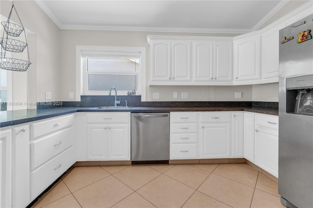9813 SW 57th St, Cooper City, FL 33328 - kitchen with stainless steel appliances, ornamental molding, a sink, white cabinetry, and dark countertops