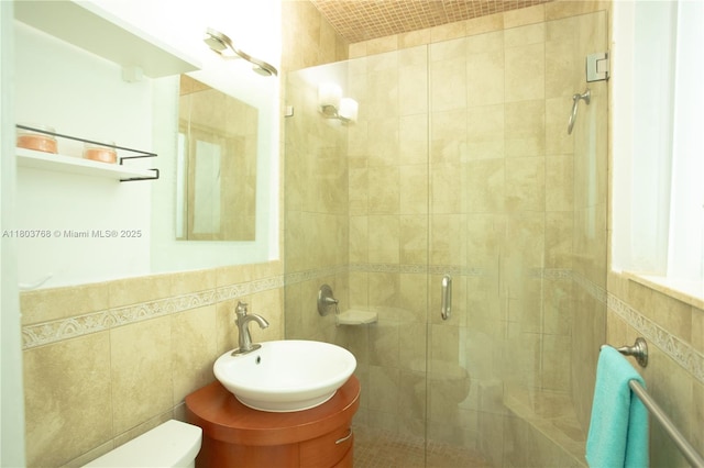 8851 Byron Ave, Surfside, FL 33154 - full bath with tile walls, a shower stall, and vanity