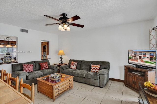16465 NE 26th Ave Unit 18, North Miami Beach, FL 33160 - living area featuring ceiling fan, light tile patterned floors, and a textured ceiling