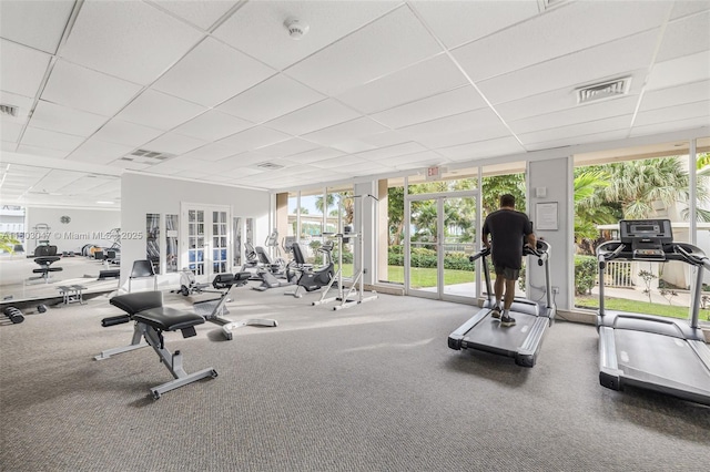 300 Bayview Dr Unit 812, Sunny Isles Beach, FL 33160 - gym featuring french doors, healthy amount of natural light, and a paneled ceiling