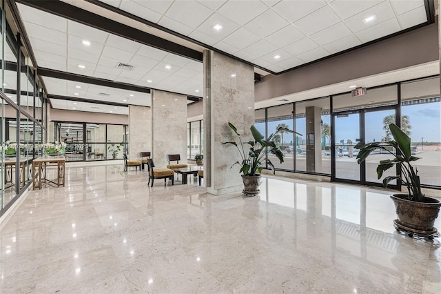 300 Bayview Dr Unit 812, Sunny Isles Beach, FL 33160 - lobby featuring a towering ceiling and a drop ceiling