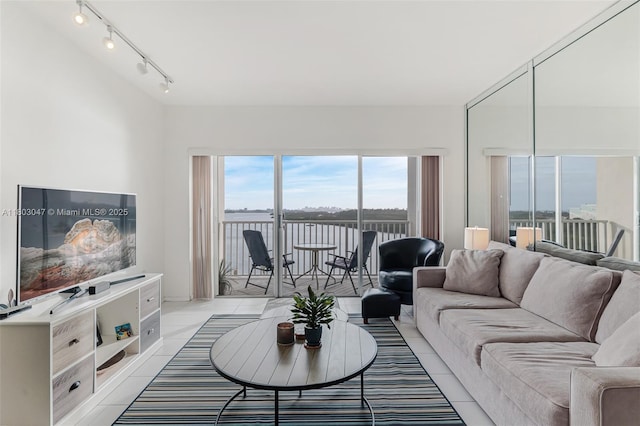 300 Bayview Dr Unit 812, Sunny Isles Beach, FL 33160 - living area with rail lighting and light tile patterned floors