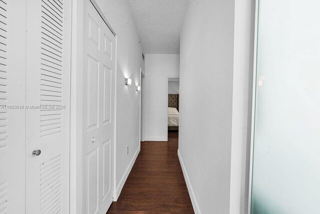 275 NE 18th St Unit 306, Miami, FL 33132 - hallway with baseboards and dark wood finished floors