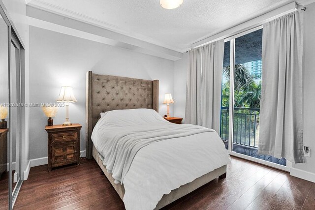275 NE 18th St Unit 306, Miami, FL 33132 - bedroom featuring hardwood / wood-style flooring, crown molding, a textured ceiling, and access to outside