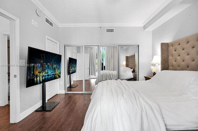 275 NE 18th St Unit 306, Miami, FL 33132 - bedroom featuring crown molding, wood finished floors, and access to outside