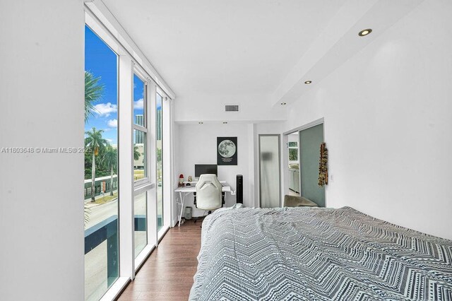 275 NE 18th St Unit 306, Miami, FL 33132 - bedroom featuring access to exterior, wood finished floors, recessed lighting, and an office area
