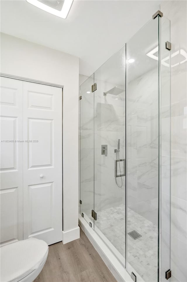 2021 N 53rd Ave, Hollywood, FL 33021 - full bath with wood finished floors, a marble finish shower, and toilet