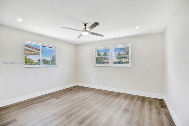 2021 N 53rd Ave, Hollywood, FL 33021 - empty room featuring plenty of natural light, wood finished floors, baseboards, a ceiling fan, and recessed lighting