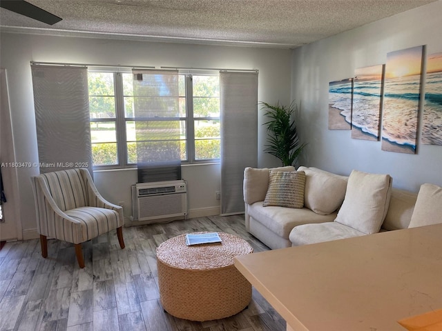 172 Prescott I 172, Deerfield Beach, FL 33442 - living room with a textured ceiling, wood finished floors, and baseboards