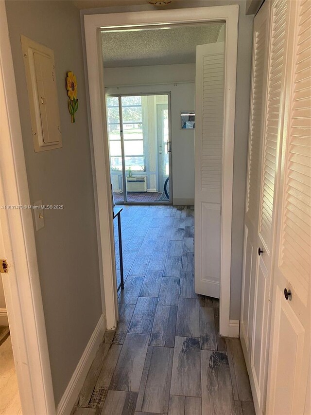 172 Prescott I 172, Deerfield Beach, FL 33442 - hallway with electric panel, baseboards, and wood finished floors