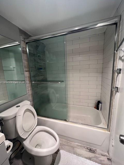 172 Prescott I 172, Deerfield Beach, FL 33442 - bathroom featuring toilet and bath / shower combo with glass door