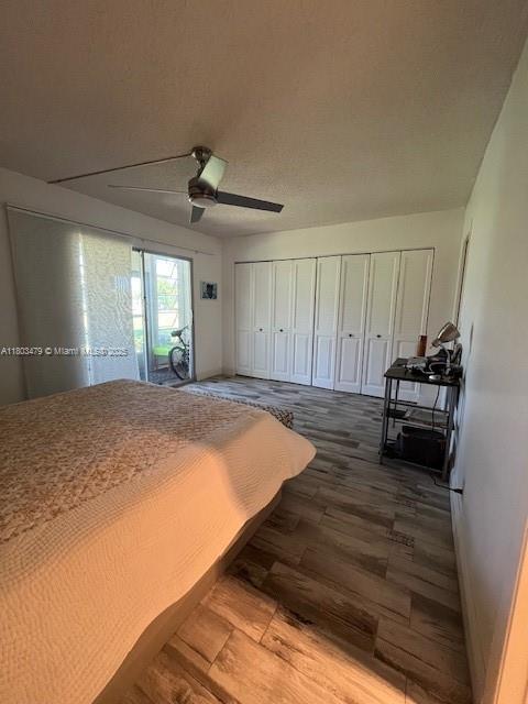 172 Prescott I 172, Deerfield Beach, FL 33442 - bedroom featuring wood finished floors, access to exterior, and a ceiling fan