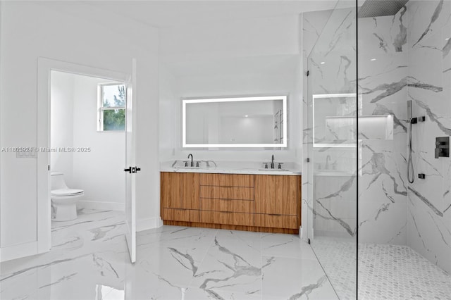 bathroom featuring marble finish floors, a marble finish shower, toilet, double vanity, and baseboards