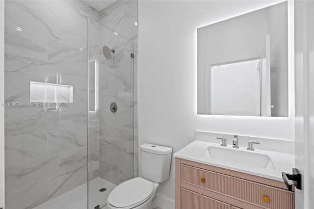 bathroom featuring a marble finish shower, toilet, and vanity