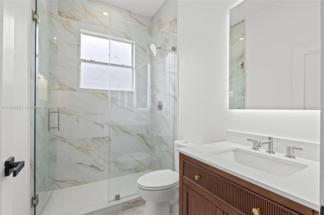 full bathroom featuring toilet, a marble finish shower, and vanity